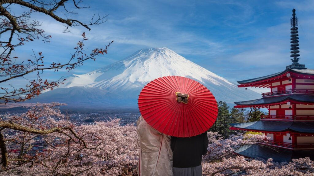 Fujiyoshida,,Red,Tower,And,Cherry,Blossom,Park,With,Mount,Fuji